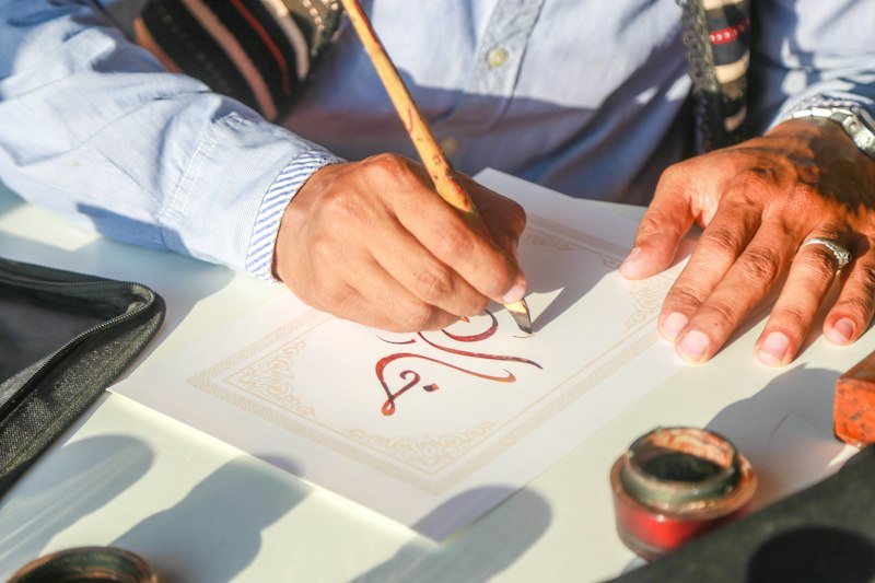 Student practicing Arabic writing