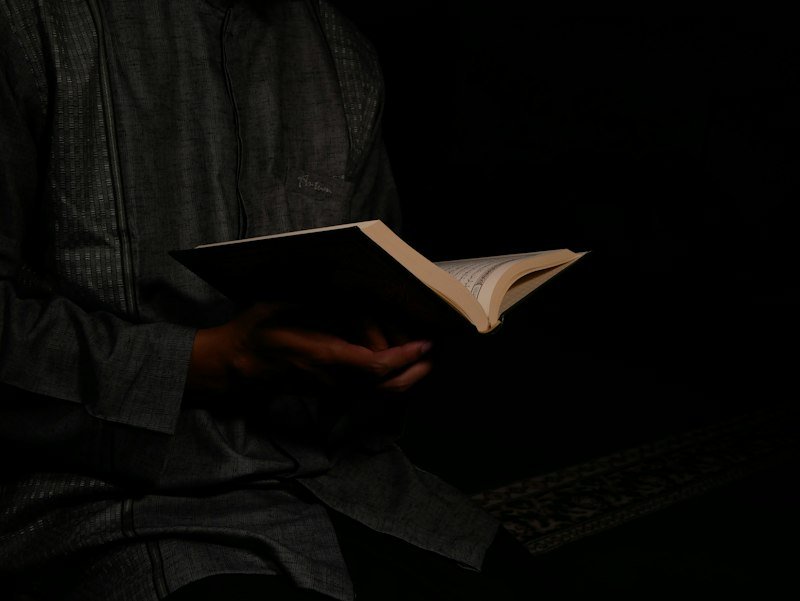 Student reading Quran during a memorization course